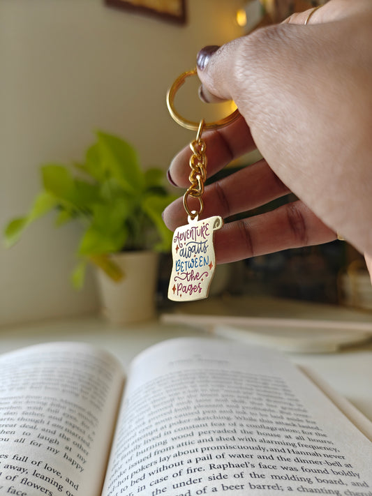 Adventure awaits between the pages - Bookish Enamel Keychain