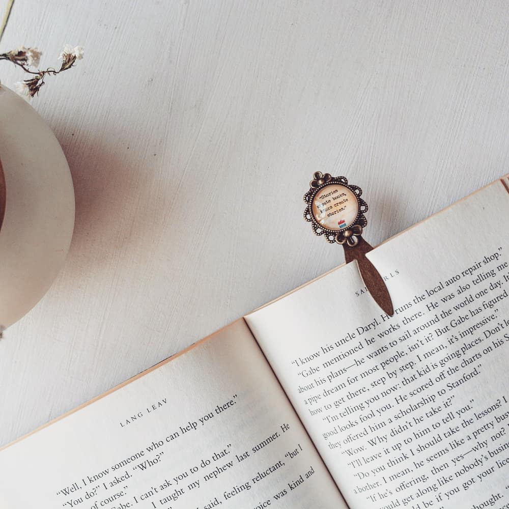 Stories create books, books create stories - Bookish Quote Bookmark
