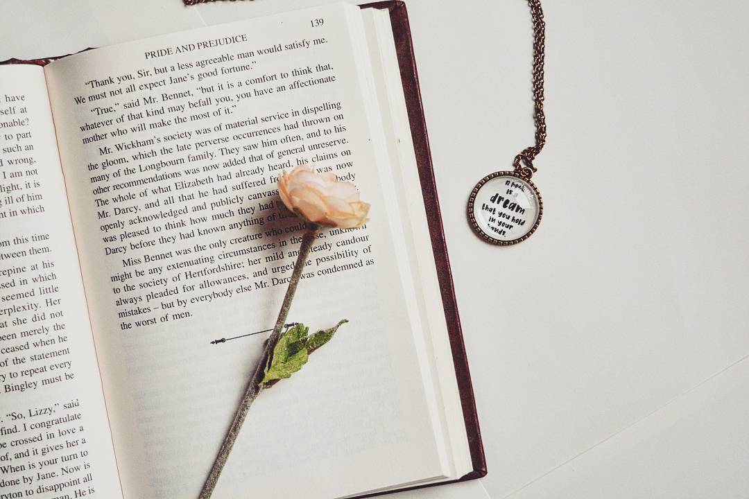 A book is a dream that you hold in your hands - Neil Gaiman Quote Pendant