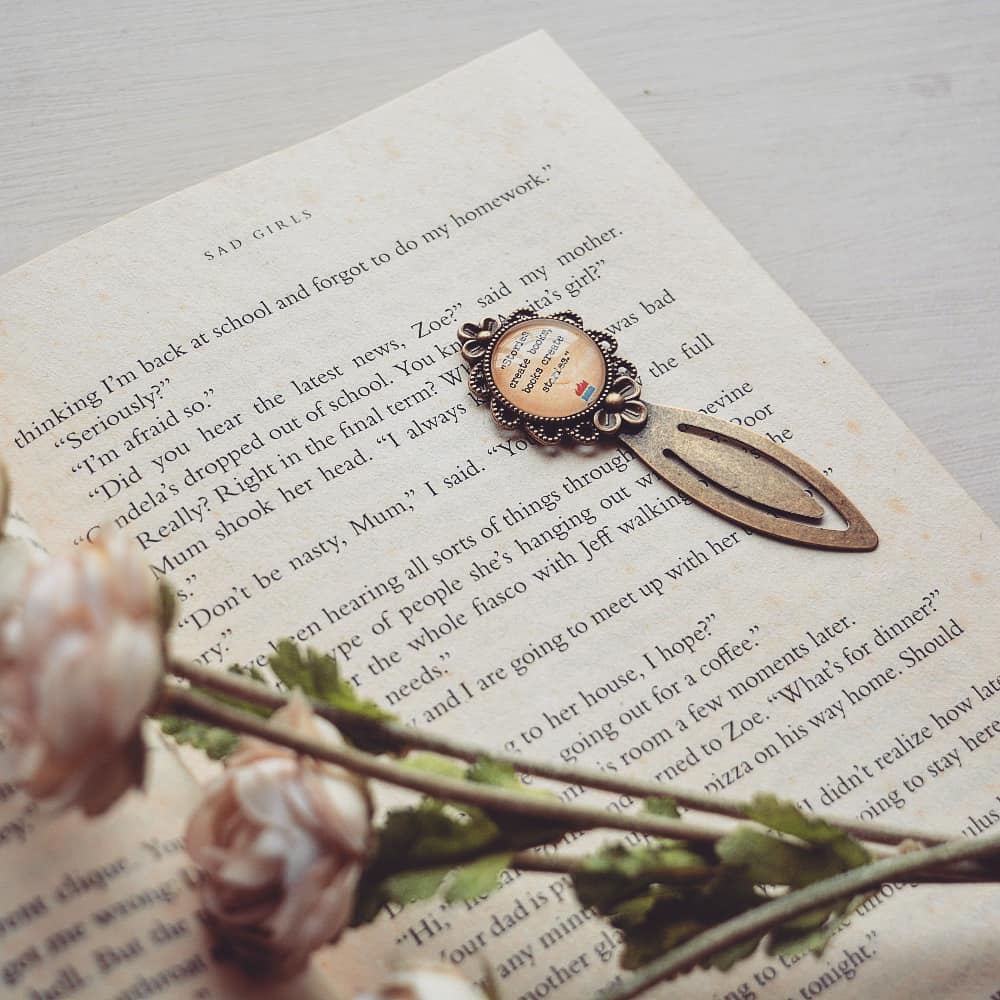 Stories create books, books create stories - Bookish Quote Bookmark