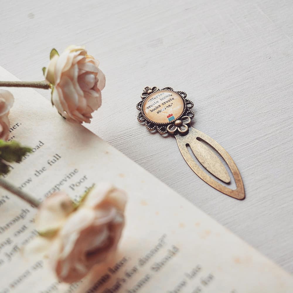 Stories create books, books create stories - Bookish Quote Bookmark