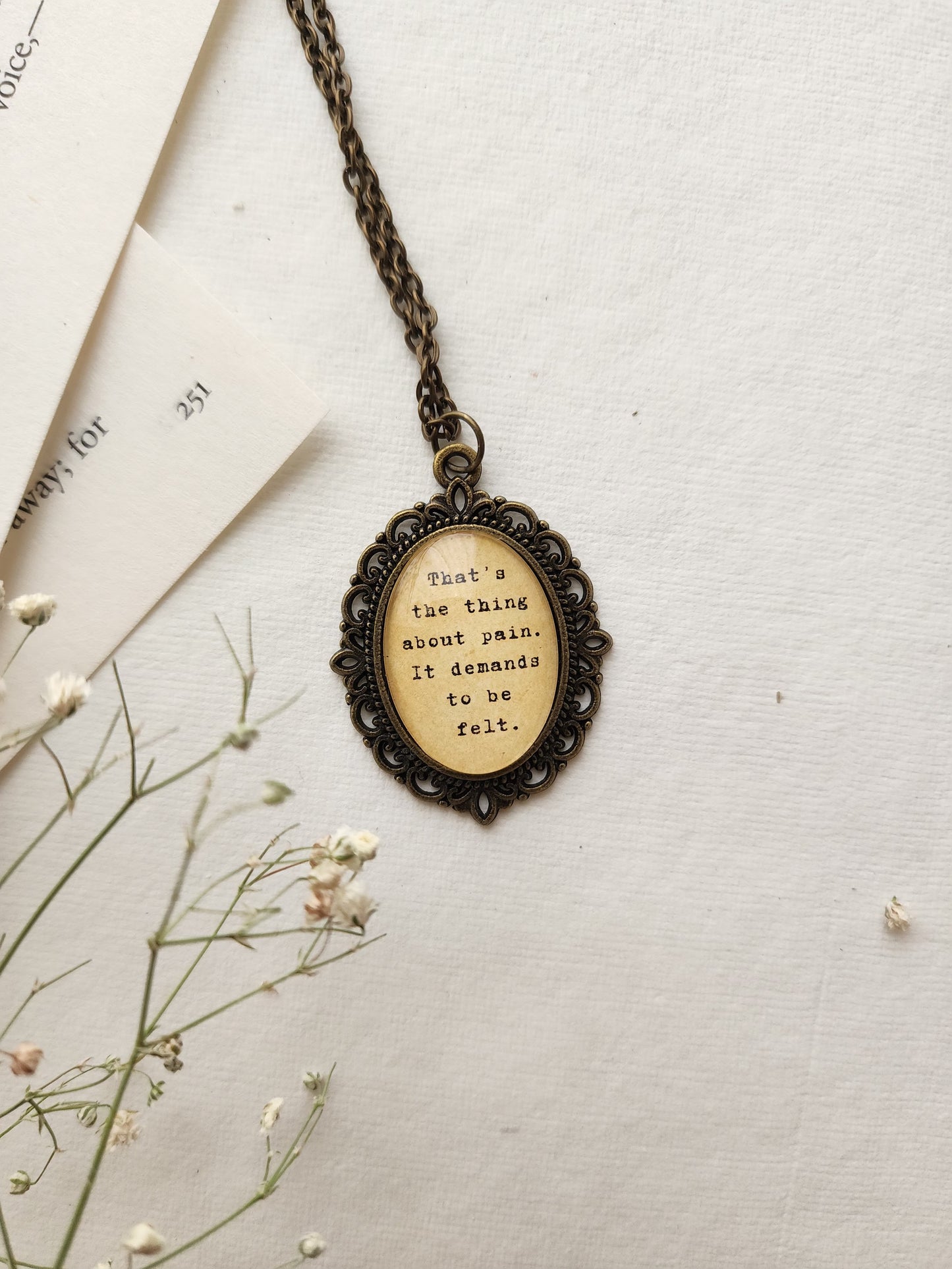 "the thing about pain... " Quote Pendant