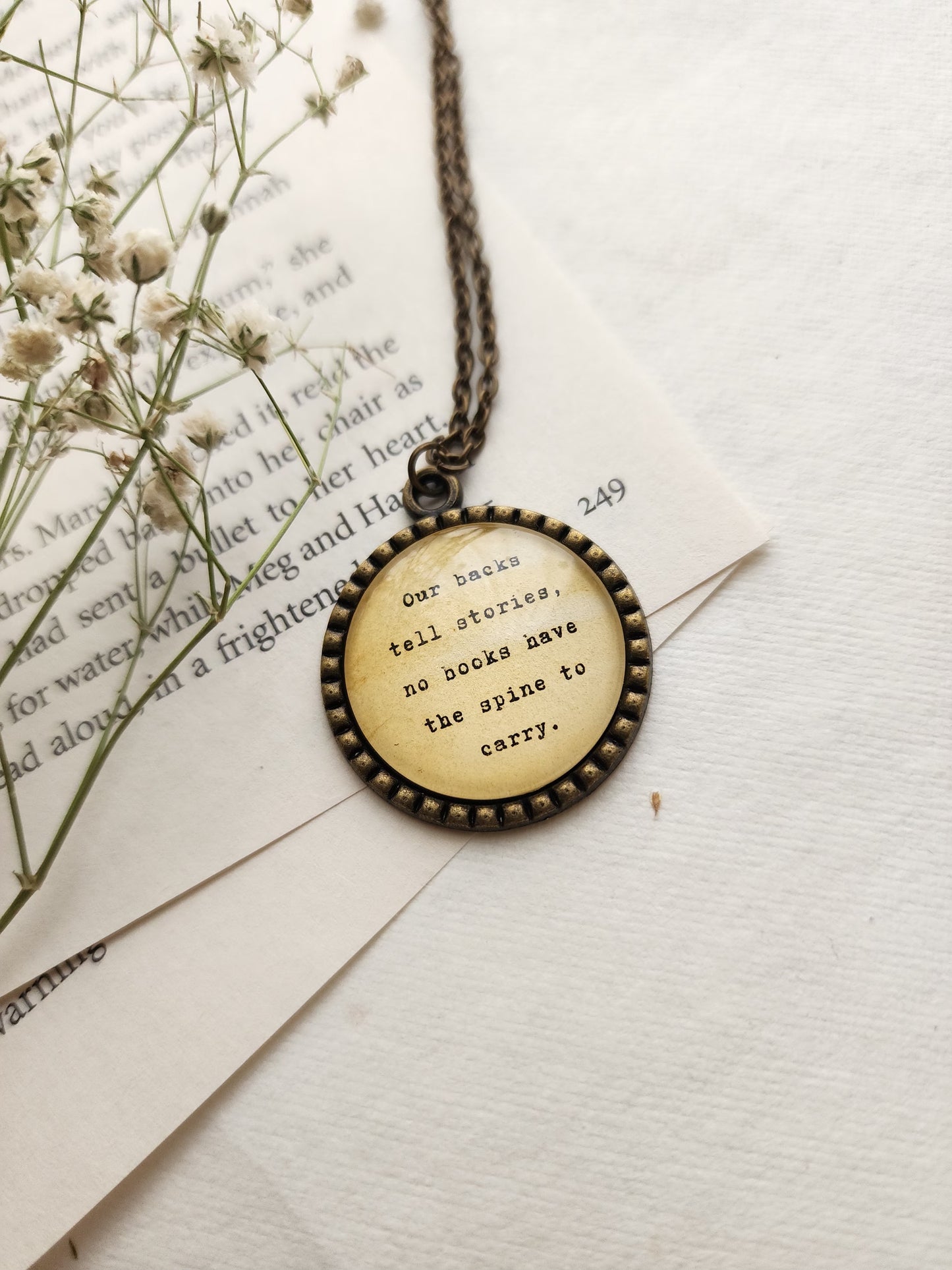 "our backs tell stories....” Quote Pendant