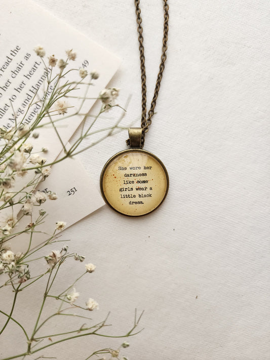 "she wore her darkness....” Quote Pendant