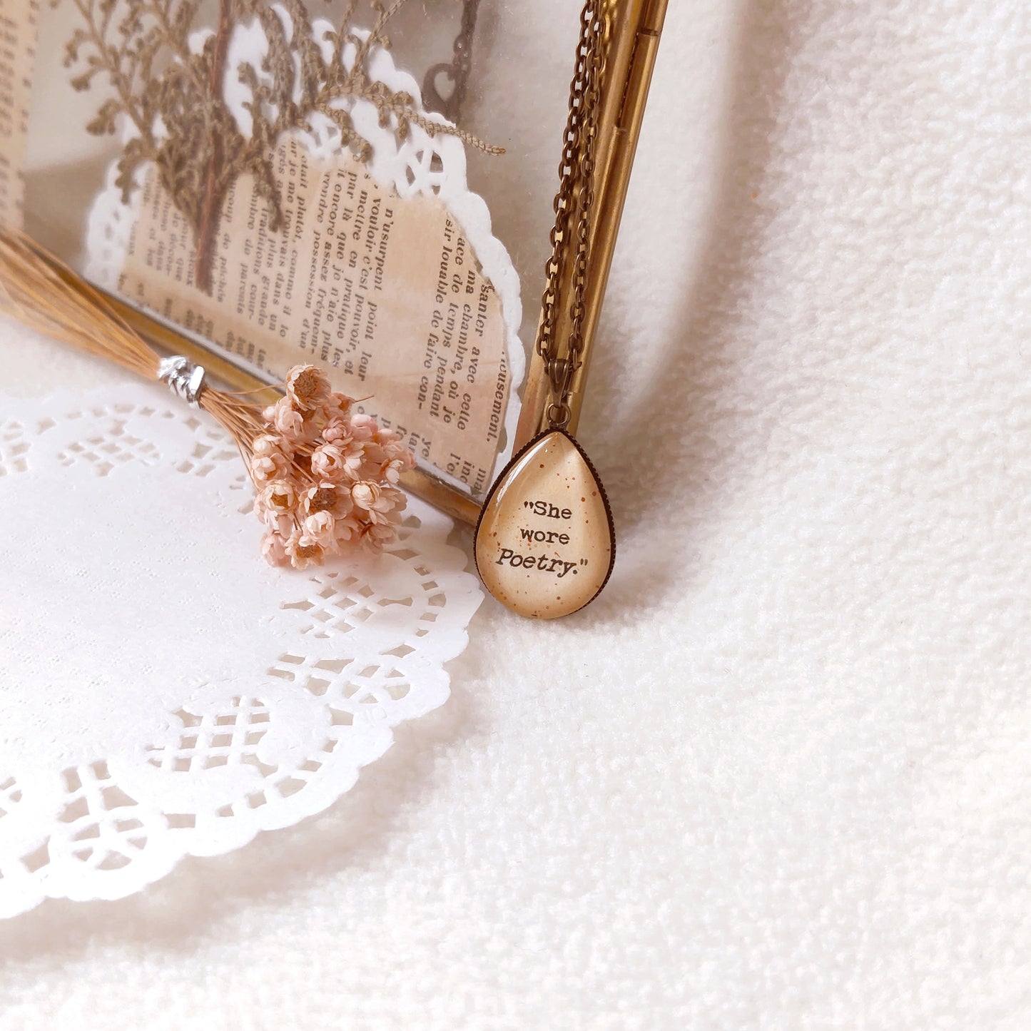 "She wore poetry"  Tear-drop Quote Pendant