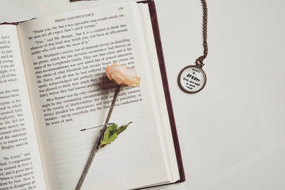 A book is a dream that you hold in your hands - Neil Gaiman Quote Pendant