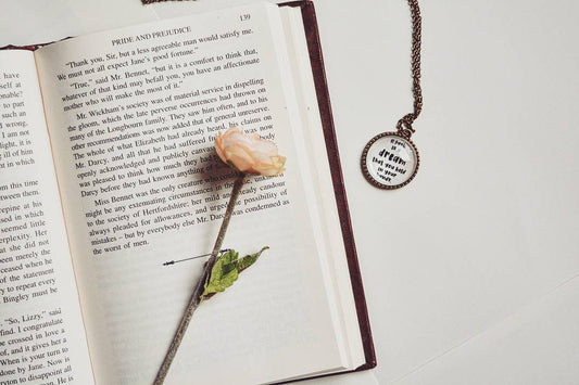 A book is a dream that you hold in your hands - Neil Gaiman Quote Pendant